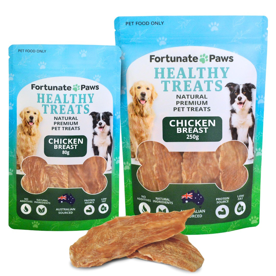 Two packages of Fortunate Paws healthy treats with a chicken breast treat in front.