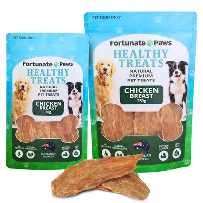 Two packages of Fortunate Paws healthy treats with a chicken breast treat in front.